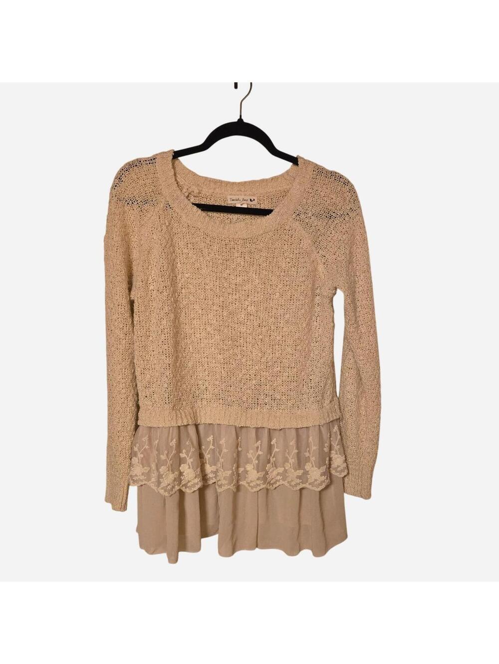 Bohochic cream-colored knit sweater features delicate floral lace detailing